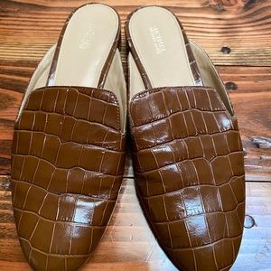 Michael Kors embossed leather slides.